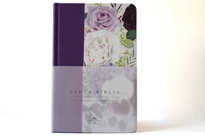 Biblia RVR1960 Tapa dura y tela morada con flores tamaño manual